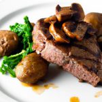 Savor the Perfect Grilled Steak with Baked Potatoes & Greens