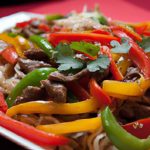 Sizzling Beef Stir-Fry with Bell Peppers & Rice Noodles Delight